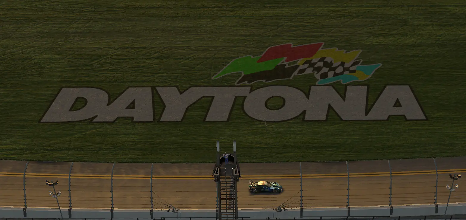 Looking down on the Daytona banking and the infield DAYTONA lettering as a GT3 car passes