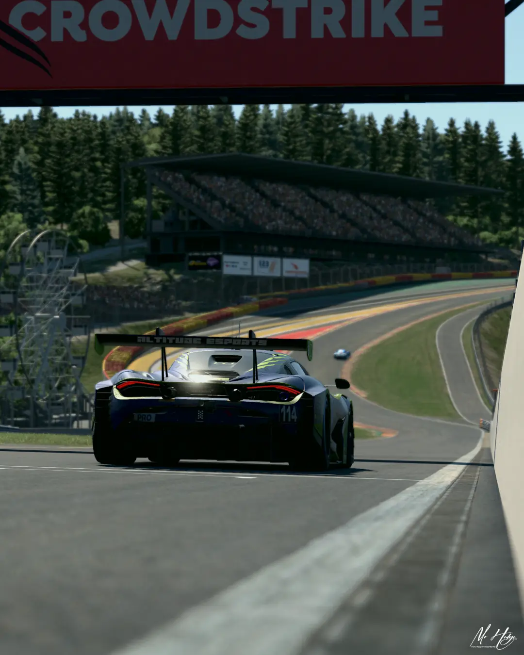The number 114 Altitude Esports McLaren 720S GT3 climbing Eau Rouge and Raidillon at Spa-Francorchamps